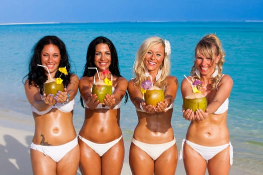 Girl group on the beach in the Maldives