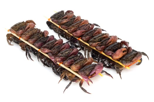 close up of skewered crabs, traditional food in asia