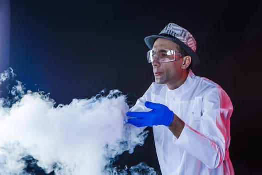 Smiling man scientist with dry ice