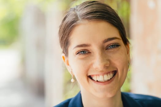 Portrait of beautiful young woman at outdoors