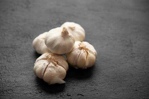 Top view garlic with copy space on dark background.