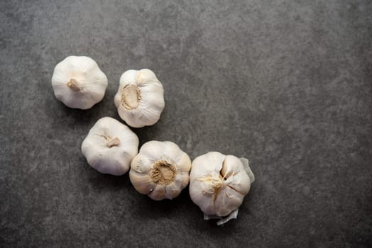 Top view garlic with copy space on dark background.