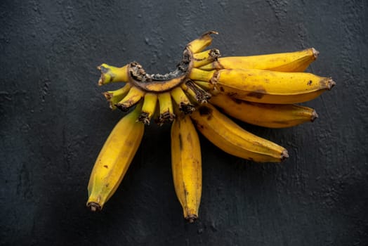 Overripe  bananas on dark background.