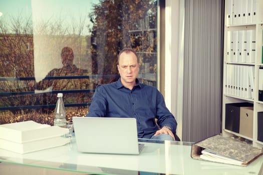 young business man at his desk working