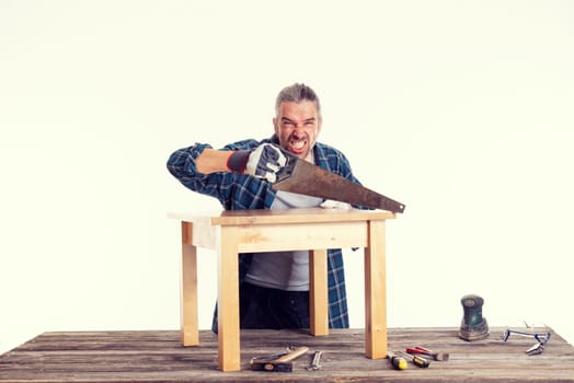 funny worker in blue plaid  shirt working with wood