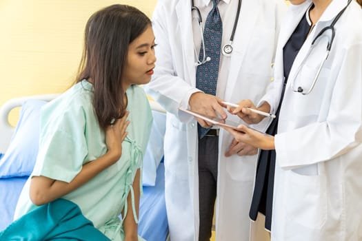 Doctor explain treatment method to inpatient in beauty clinic using tablet