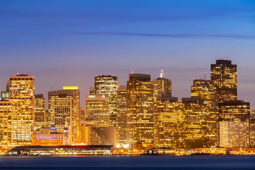San Francisco downtown skyline at dusk from Treasure Island, California, sunset, USA.