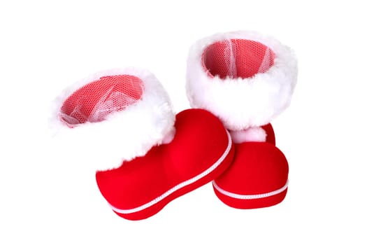Christmas decorations. A pair of red Christmas boots or Santa Claus boots isolated on a white background.