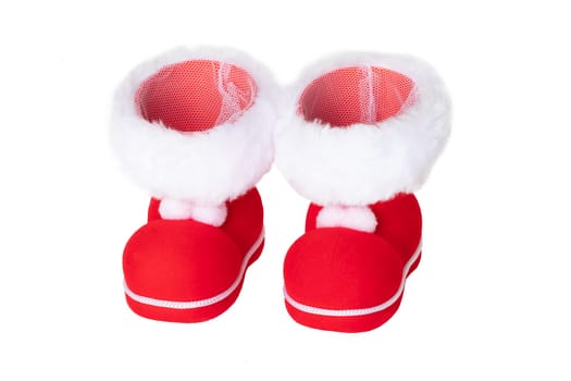 Christmas decorations. A pair of red Christmas boots or Santa Claus boots isolated on a white background.
