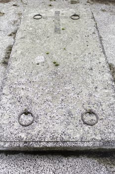 Old stone coffin with cross and saddlebags, religion and belief