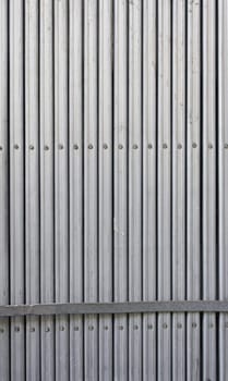 Bright steel gate door closed in trade, construction