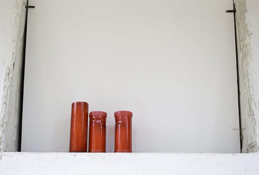 Red candles on grave in cemetery, area and religion