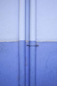 Blue pipes in the structure of a building, installation and supply
