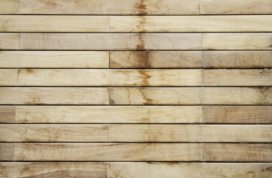 Dark and light wood planks on the door of a building, construction and decoration