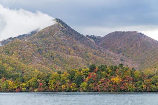Lake Chuzenji is a scenic lake in the mountains above the town of Nikko. It is located at the foot of Mount Nantai, Nikko's sacred volcano, whose eruption blocked the valley below, thereby creating Lake Chuzenji about 20,000 years ago. This photo was shot in autumn