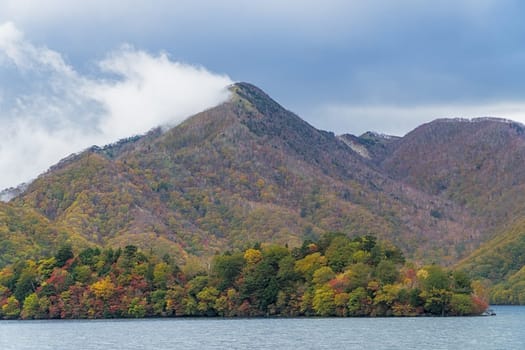 Lake Chuzenji is a scenic lake in the mountains above the town of Nikko. It is located at the foot of Mount Nantai, Nikko's sacred volcano, whose eruption blocked the valley below, thereby creating Lake Chuzenji about 20,000 years ago. This photo was shot in autumn