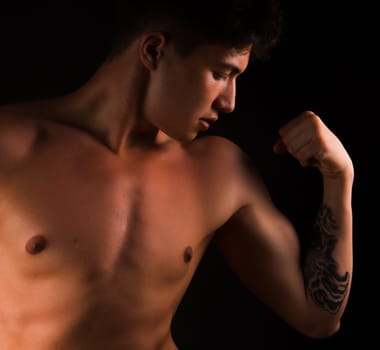 Musculed model posing in studio