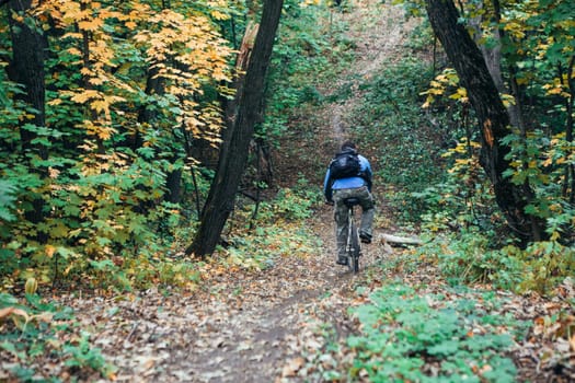 Man with bike in forest