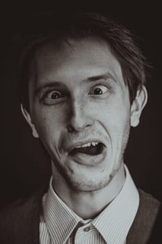 Studio shot of an handsome and expressive man on isolated backgroun