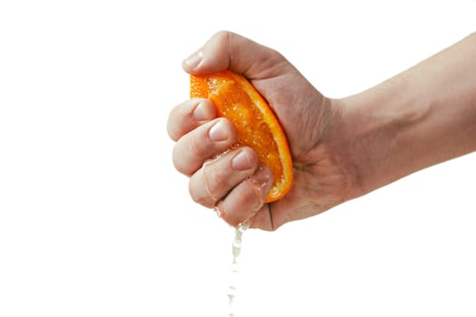man dramatic squeezes orange. Concept squeezed a man is tired from work.