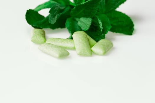 green chewing gum on white - food and drink