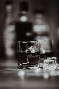 2 glasses of whiskey black and white