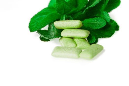 green chewing gum on white - food and drink