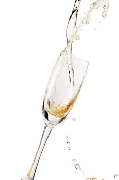 White wine splashing out of glass, isolated on white background