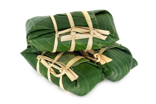 Sticky Rice In Banana Leaf, traditional thai food on white background