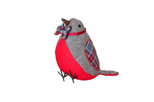 Christmas decoration background. A red christmas fabric bird carries a colorful bow tie and is isolated on a white background.