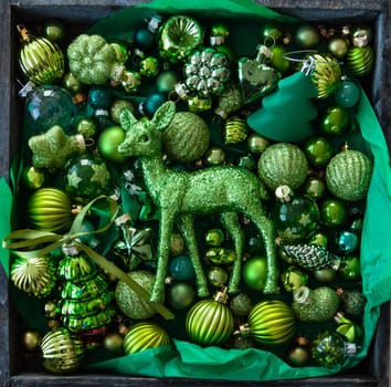 Cheerful decorations and ornaments in various green tones for Christmas