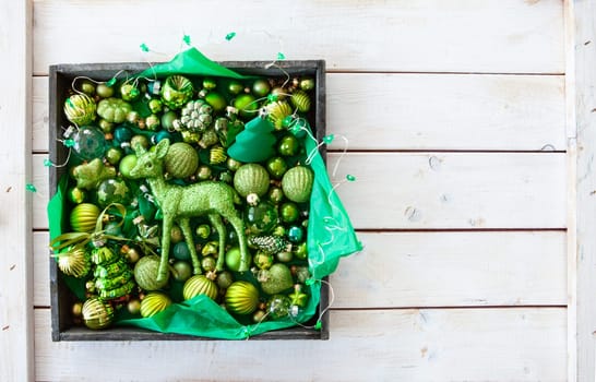 Cheerful decorations and ornaments in various green tones for Christmas