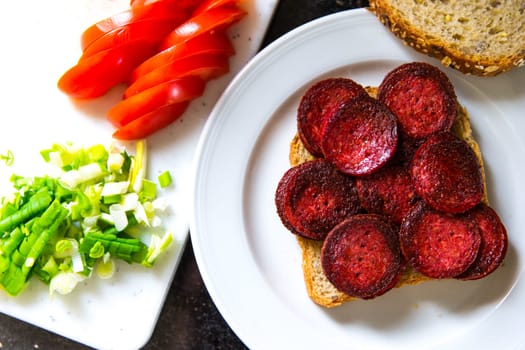 Sandwich with fried slices of Sausage
