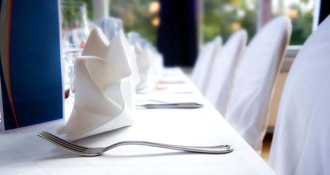 Glasses and plates on table in restaurant