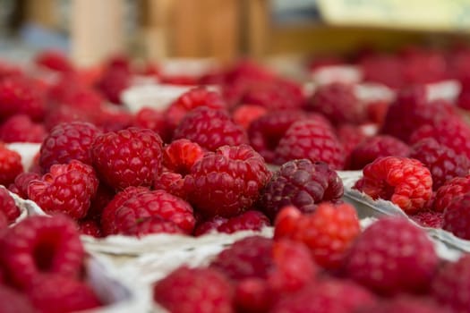Baskets of Raspberries Macro at Local Food Market