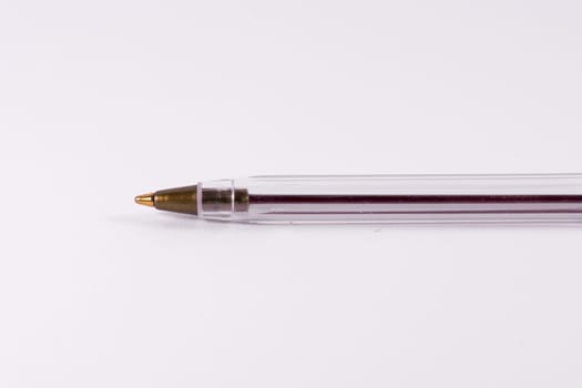 Red Pen Tip Cap Tube Plastic Clear Office Supply White Background Closeup