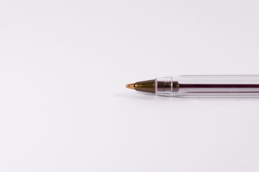Red Pen Tip Cap Tube Plastic Clear Office Supply White Background Closeup