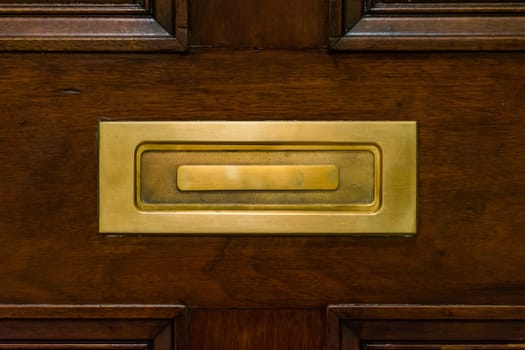 Brown Wooden Door Closed Mailslot Golden Metal Closeup Texture Post