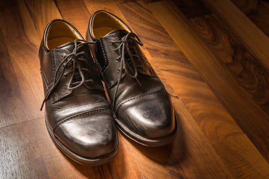 Black Leather Dress Shoes Worn Wooden Floor Sunlight Spotlight Sheen Elegenat Business Casual