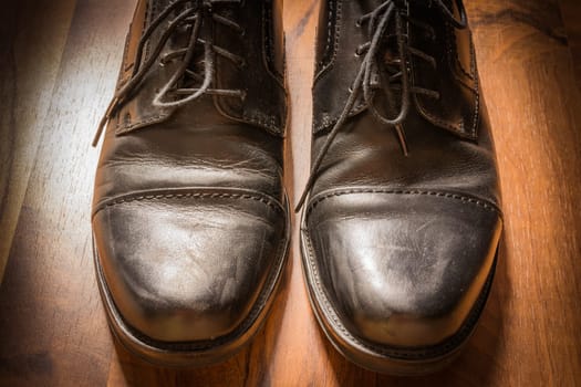 Black Leather Dress Shoes Worn Wooden Floor Sunlight Spotlight Sheen Elegenat Business Casual