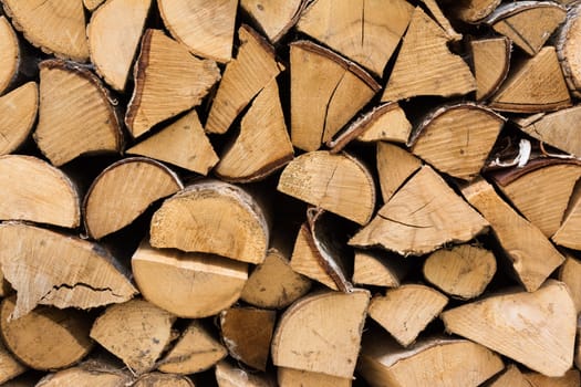 Chopped FIrewood Stacked Against Wall Detail Texture