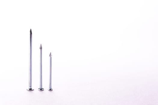 Chrome Metal Nails Decreasing Bar Graph Construction White Background