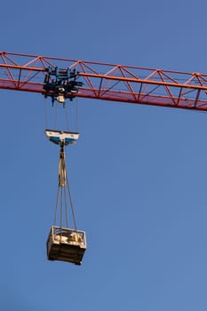 Red Crane Arm Holding Load Construction Industry