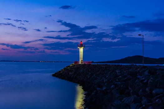 Purple Twilight Ocean Reflection Lighthouse on Rocks Howth Ireland