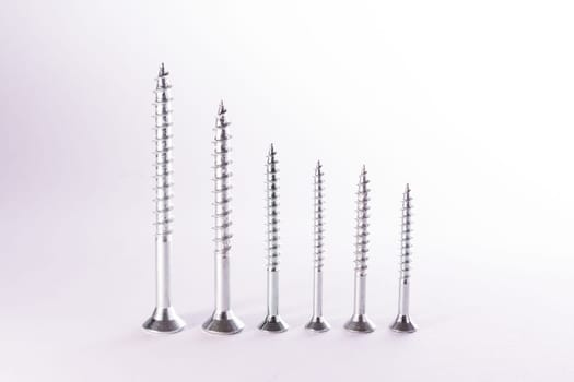 Decreasing Bar Graph Pattern Metal Screws Construction White Background