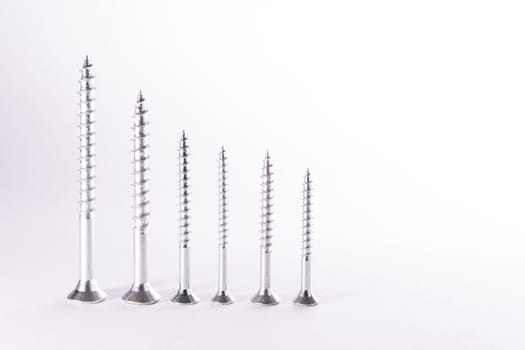 Decreasing Bar Graph Pattern Metal Screws Construction White Background