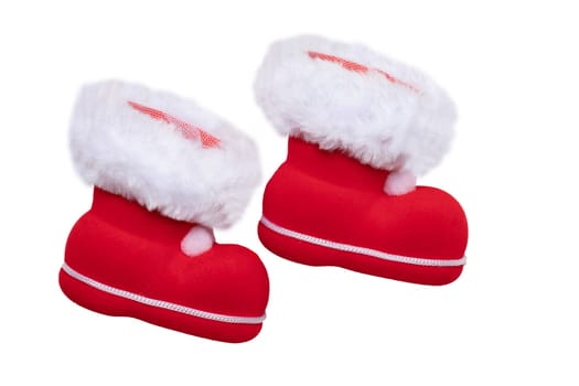 Christmas decorations. A pair of red Christmas boots or Santa Claus boots isolated on a white background.