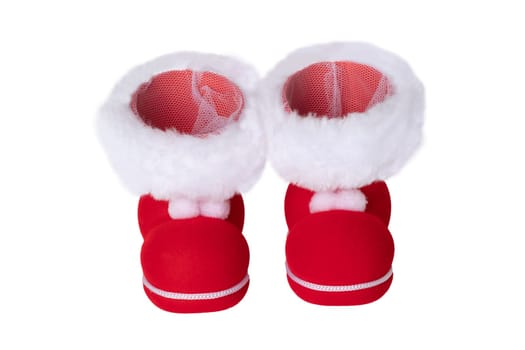 Christmas decorations. A pair of red Christmas boots or Santa Claus boots isolated on a white background.