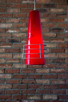 Stylish Cone Lamp Hanging with Blurred Brick Wall