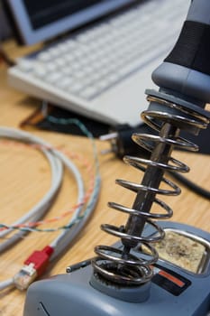 Soldering Iron Closeup Engineering Workspace Desk Electronics Metal Coil Stand Idle